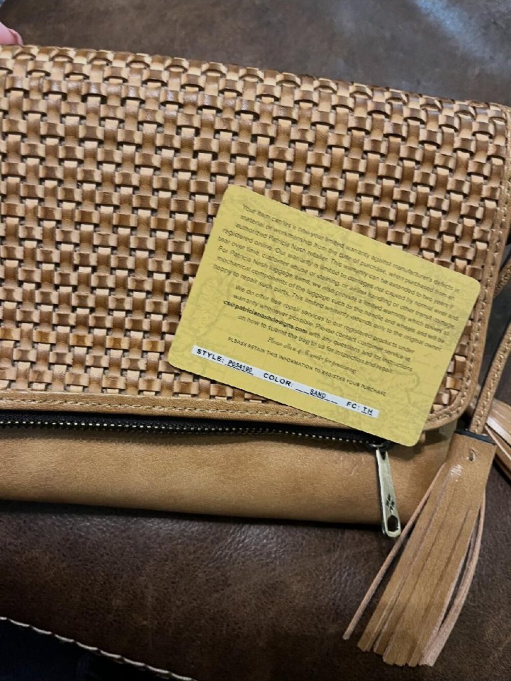 Patricia Nash Corfu small woven crossbody in sand leather.